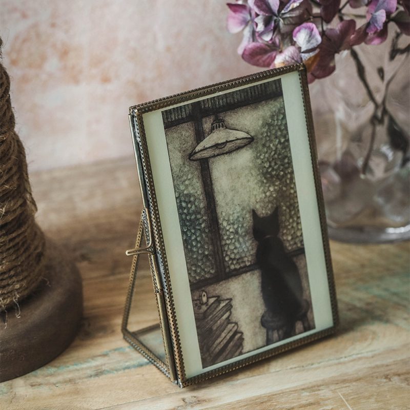 brass and glass standing mirror